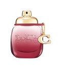 Coach Wild Rose Eau de Parfum — deep rose ombre bottle with gold cap and Coach C charm